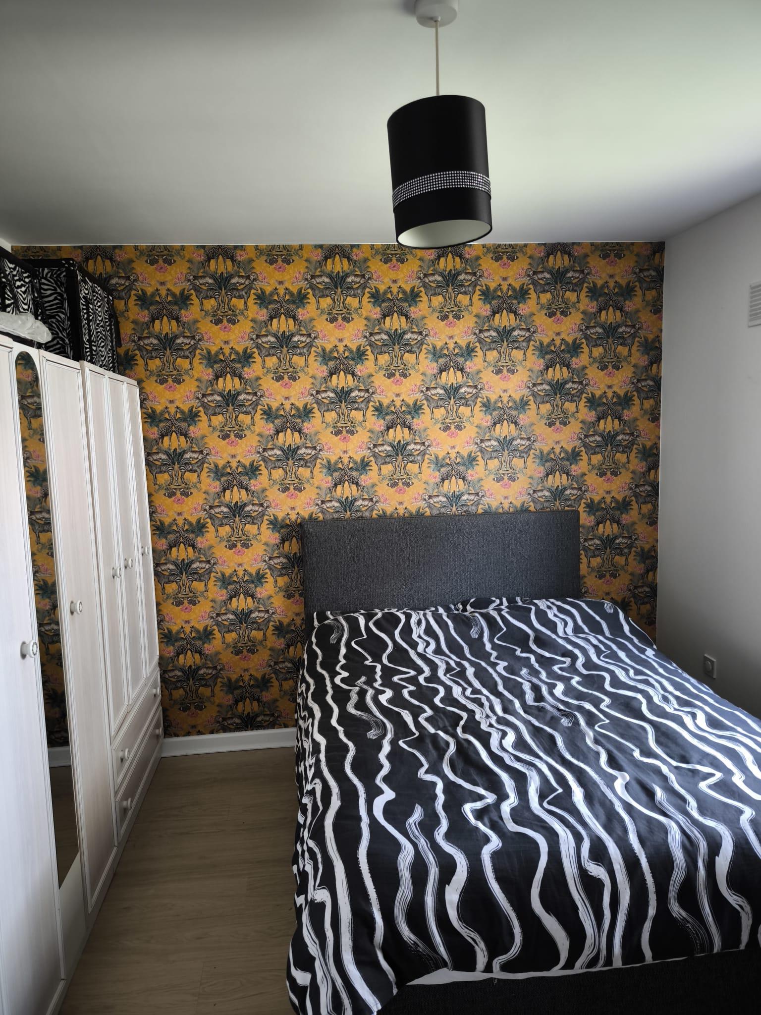 Modern bedroom with feature wallpaper